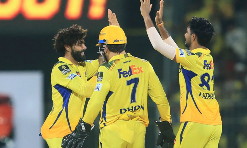 CSK Wicketkeeper after MS Dhoni celebrating a crucial moment with teammates during an IPL match.